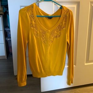 Mustard yellow cardigan with crocheted details
